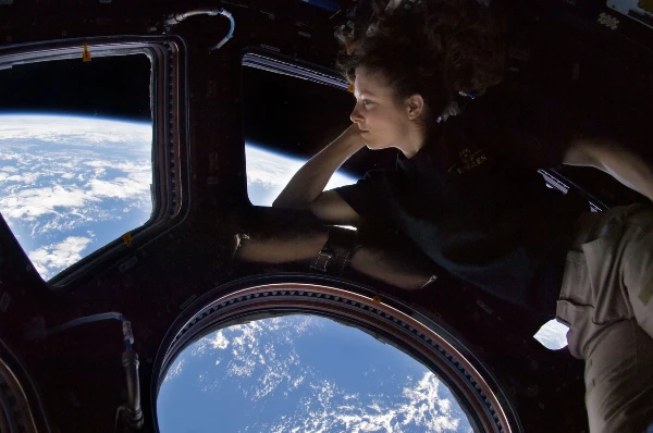 Astronaut looking out into outer space
